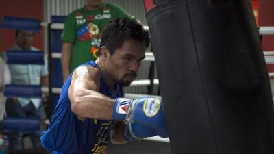 In this photo taken on September 29, 2016, Philippines boxer Manny Pacquiao trains at a gym in Manila. Pacquiao and British fighter Amir Khan confirmed separately on February 26, 2017 that they would face each other on April 23 after weeks of conflicting reports. Ted Aljibe / AFP