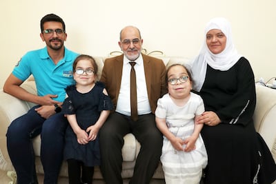 Samir Hamasha, centre, with his wife, daughters Saba and Bushra and son Loay at their home in Dubai. Pawan Singh / The National