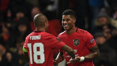 Manchester United Marcus Rashford, right, celebrates scoring their third goal. AFP