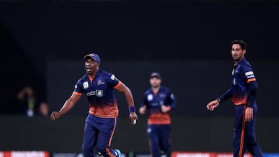 Arabians' Dwayne Bravo celebrates the run out of Qalandars batsman Phil Salt. Chris Whiteoak / The National