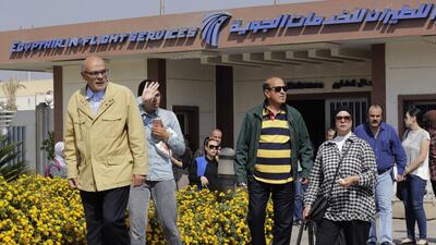 Relatives of passengers on a vanished EgyptAir flight leave the Egyptair in-flight service building where they were held at Cairo International Airport. Egyptian aviation officials say an EgyptAir flight from Paris to Cairo with 66 passengers and crew on board has crashed. Amr Nabil / AP