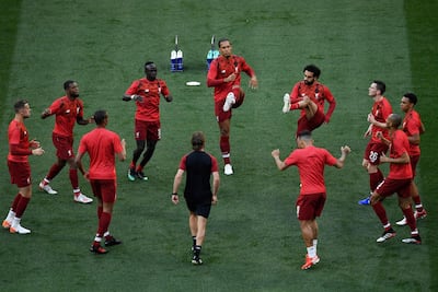 Liverpool's players warm up. AFP