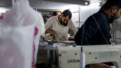 As the end of Ramadan approaches, tailors in Dubai's bustling Satwa neighbourhood are working overtime to prepare. All photos: Antonie Robertson / The National