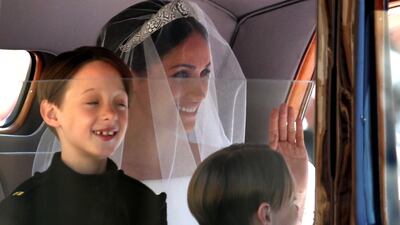 Page boys John and Brian Mulroney joined Meghan Markle in the Rolls Royce she rode in to St George's Chapel. AFP