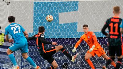 Zenit's Magomed Ozdoev, left, scores his side's third goal during the Champions League match against Chelsea at the Gazprom Arena in St Petersburg on Wednesday. AP