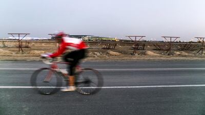 Cyclists whizz along Dubai's Nad Al Sheba Cycle Path. Reem Mohammed / The National