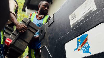 Employees of the Democratic Republic of Congo's Independent National Electoral Commission deliver voting machines and materials to a polling station in Kinshasa. Reuters