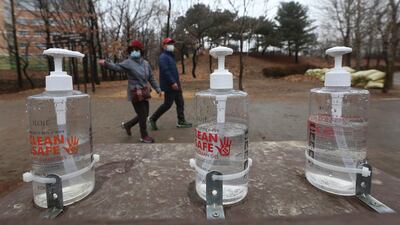 Bottles of hand sanitizer are displayed for use at a park in Goyang, South Korea, Friday, Jan. 22, 2021. South Korea is reporting its smallest daily increase in coronavirus infections in two months as officials express cautious hope that the country is beginning to wiggle out from its worst wave of the pandemic. (AP Photo/Ahn Young-joon)