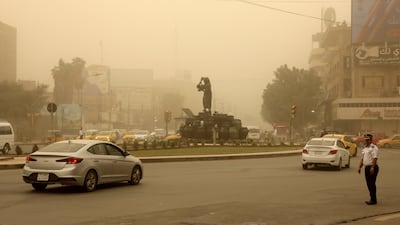 Kahraman Square in central Baghdad is shrouded with heavy dust on April 12. EPA