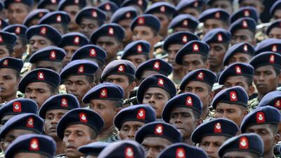 Sri Lankan soldiers march during a Victory Day parade in the southern town of Matara. The government is holding a military “victory parade” to mark five years since the defeat of Tamil Tiger rebels, who waged a decades-long battle for a separate homeland for minority Tamils. Lakruwan Wanniarachichi / AFP