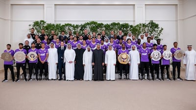 President Sheikh Mohamed and Sheikh Khaled bin Mohamed, Crown Prince of Abu Dhabi, with staff and players from Adnoc Pro League title winners Al Ain. All photos: UAE Presidential Court