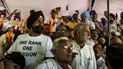 Indian Army veterans celebrate following the government's announcement that it will accept One Rank One Pension (OROP) reforms in New Delhi on September 5. AFP Photo