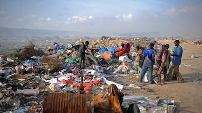 People scavenging at the Wadajir municipal dumping site in Mogadishu, Somalia. The United Nations celebrate on June 5 the World Environmental Day dedicated this year to the theme "Beat Plastic Pollution". Mohamed Abdiwahab / AFP