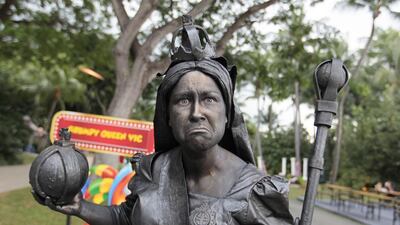British busker ‘Grumpy Queen Victoria’ poses for a photograph during the Sentosa Buskers Festival 2014 in Singapore on September 11, 2014. The festival features over 19 different local and international buskers from Australia, the United Kingdom and Canada. Wallace Woon / EPA