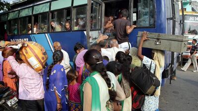 Indian villagers board a bus as families are evacuated from their homes near the Pakistan border to a safer place. Jaipal Singh / EPA