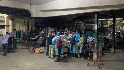Patients outside the Mariano Marcos Memorial Hospital in Batac city. AFP