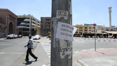 Dubai clamps down on illegal advertisers such as this one on a lamp post in Karama, Dubai. Sarah Dea/The National