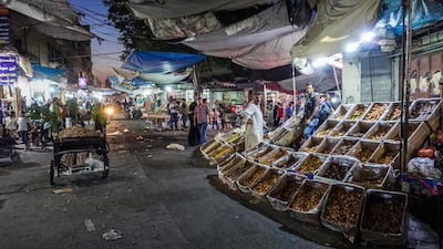 Street vendors stand by produce in Ariha, on the southern outskirts of Syria's rebel-held Idlib. AFP