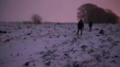 A still image taken from Russian Emergencies video of Russian Emergencies ministry rescuers working at the site the plane crash. EPA