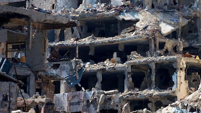 Destroyed buildings in the old city of Homs, Syria. Some 1,200 rebels and civilians, many of them wounded and starving from a yearlong siege, withdrew from the last remaining strongholds in the ancient heart of Homs in May 2014, surrendering to President Bashar Assad a bloodstained city once dubbed the “capital of the revolution.” Hassan Ammar / AP
