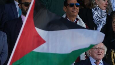 Irish President Michael D Higgins, below right, at the friendly in Dublin. PA