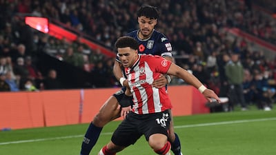 Che Adams:7 - The striker put in a hard-working performance throughout, chasing everything and trying to cause chaos. AFP