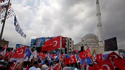 People wave Turkish flags during an election rally of Turkey's President Recep Tayyip Erdogan and his ruling Justice and Development Party, or AKP, in Istanbul, Turkey, on June 23, 2018. Lefteris Pitarakis / AP Photo