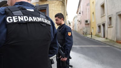 Armed gendarmes stand guard in a street in Marseillan, about 40 kilometres southwest from Montpellier, southern France, on February 10, 2017, where suspects, including a 16-year-old girl, believed to be involved in plotting an attack were arrested by French anti-terrorist police. Sylvain Thomas / AFP