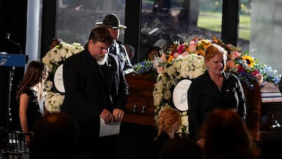 Members of the Carter family depart after a repose service. AP
