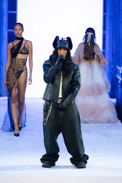 Dina Ayada performs during the Etam Womenswear Spring/Summer 2025 show as part of Paris Fashion Week. Alamy