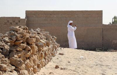 Another student from taking photographs with his smart phone during the photography workshop at Al Jazirah Alhamra old town in Ras Al Khaimah. Pawan Singh / The National