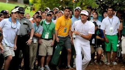 Bubba Watson takes his 'crazy' shot on the 10th during the play-off against Louis Oosthuizen. Timothy A Clary / AFP