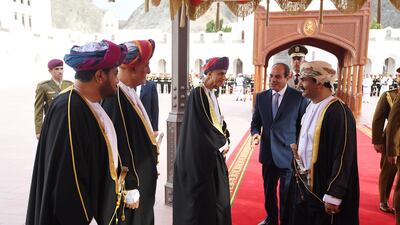 Mr El Sisi greets Omani officials.