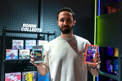 Ronald Hajjar holds two of the 21-set Pokemon cars, valued at Dh1 million. Victor Besa / The National