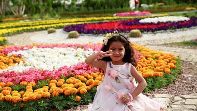 People visit 9th Flower Festival named "Flower, Culture and Vixtory" at al-Zawra Park in Baghdad. Getty Images