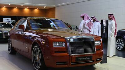 Visitors inspect a Rolls-Royce Phantom Coupe at the Dubai Motor Show at the city’s World Trade Centre. Jasper Juinen / Bloomberg