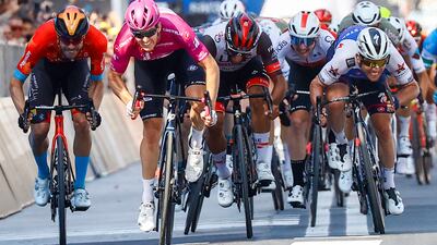 French cyclist Arnaud Demare, second left, of Team Groupama-FDJ, approaches the finish line to win, ahead of Team Bahrain's German rider Phil Bauhaus, left, Team Quick-Step Alpha Vinyl's British rider Mark Cavendish, right, and Team UAE Emirates' Colombian rider Fernando Gaviria, centre, during the 13th stage of the Giro d'Italia 2022, in Italy. AFP