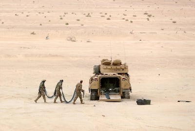 US troops carry ammunition during the live-fire training drill. Wednesday, December 18th, 2019. Abu Dhabi. Chris Whiteoak / The National