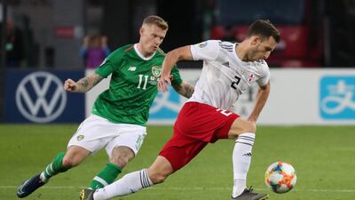 Georgia's Otar Kakabadze, left, with James McClean of the Republic of Ireland. Reuters