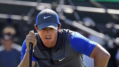 Rory McIlroy of Northern Ireland lines up a putt on the 5th green during his first round in the British Open at Hoylake, near Liverpool, on July 17, 2014. Gerry Penny / EPA