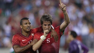 Portugal's Fabio Coentrao, right, and teammate Nani, left, celebrate a goal against Ireland in their World Cup warmup friendly on Tuesday. Jose Sena Goulao / EPA / June 10, 2014