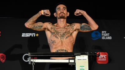 Max Holloway poses on the scale during the UFC weigh-in at Etihad Arena on UFC Fight Island. Jeff Bottari / Zuffa LLC / Getty Images / UFC