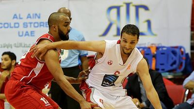 Qais Omar of UAE guards an Al Ahly Benghazi player. Satish Kumar / The National