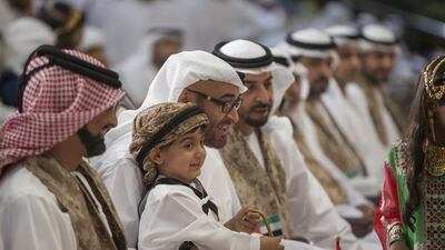 Sheikh Ammar bin Humaid Al Nuaimi, Crown Prince of Ajman, left, Sheikh Tahnoon bin Mohamed bin Tahnoon Al Nahyan, second left, Sheikh Mohammed bin Zayed, Crown Prince of Abu Dhabi and Deputy Supreme Commander of the UAE Armed Forces, third left, and Sheikh Hamdan bin Zayed , Deputy Prime Minister and Ruler of the Western Region, fourth left, at the National Day celebrations at Abu Dhabi National Exhibition Centre. Mohamed Al Hammadi / Crown Prince Court - Abu Dhabi