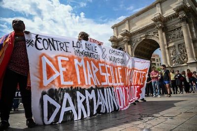Protesters take part in a demonstration against the French minister of interior's legislative proposal on asylum and immigration, in Marseille, southern France on April 29. AFP