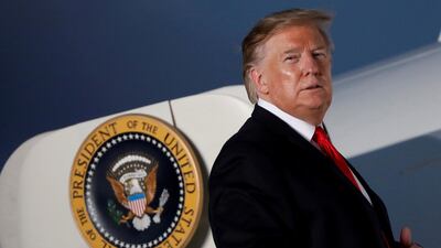 US President Donald Trump looks at supporters before boarding Air Force One.Reuters