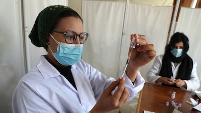 Medics prepare doses of the Pfizer-BioNTech vaccine during the booster campaign in Tunisia. EPA