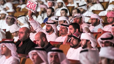 Bidders at Abu Dhabi Police's vehicle plates auction at Emirates Palace on Saturday night (Reem Mohammed/The National)