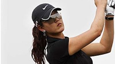 Michelle Wie completes a swing during a pro-am event at the Emirates Golf Club in Dubai yesterday.