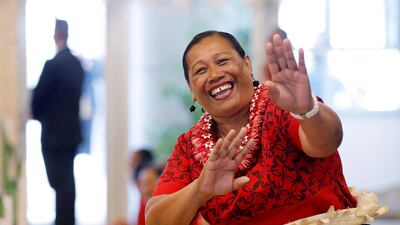 A woman reacts for the camera as she awaits the arrival of Meghan, Duchess of Sussex and Prince Harry, Duke of Sussex for their meeting with Tonga Prime Minister in Nuku'alofa, Tonga. Prince Harry and his wife Meghan are on day 11 of their 16-day tour of Australia and the South Pacific. AP Photo